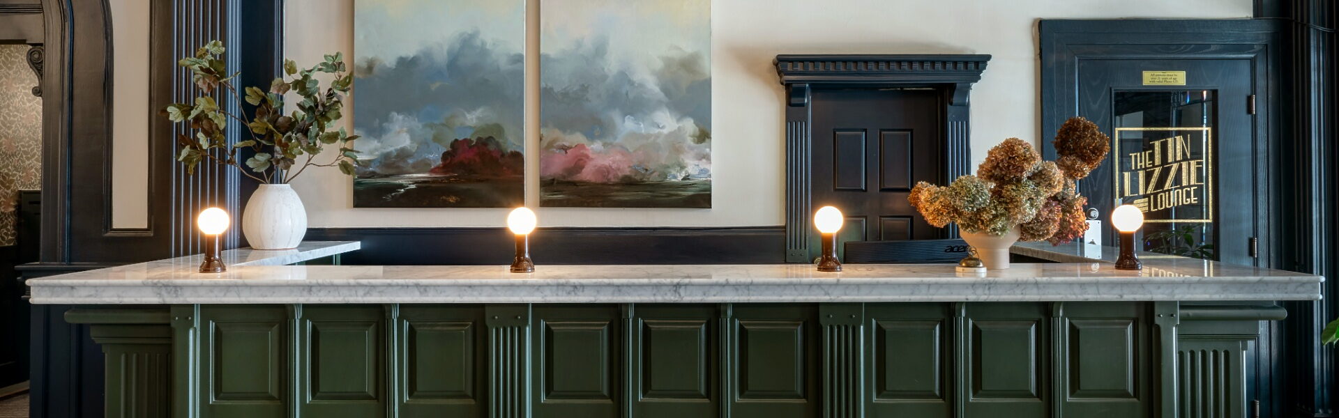 Renovated lobby and front desk area at The MarQueen Hotel in Seattle’s Queen Anne neighborhood.